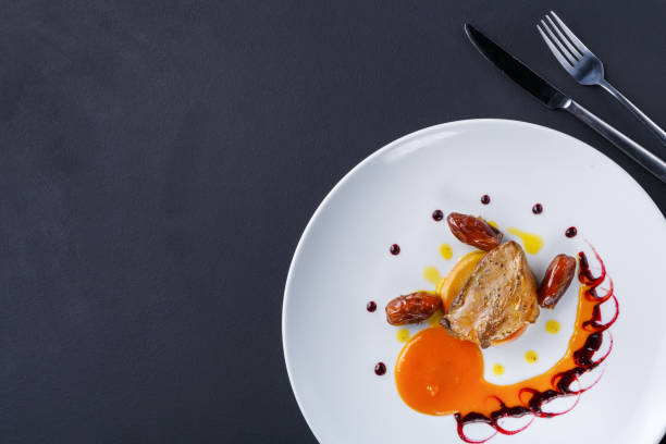 istock Roasted goose liver with date fruit and apple 887395510