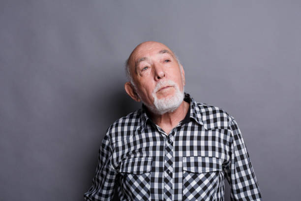 istock Pensive dreaming mature man looking up, copy space 887398610