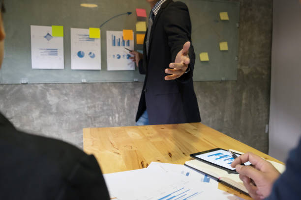istock Businessman Explaining Colleagues While Discussing In Meeting At Office 887407764