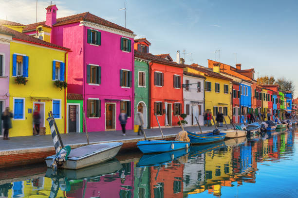Colorful Buildings of Burano, Italy Burano is an island in the Venetian Lagoon, northern Italy. saturated color stock pictures, royalty-free photos & images