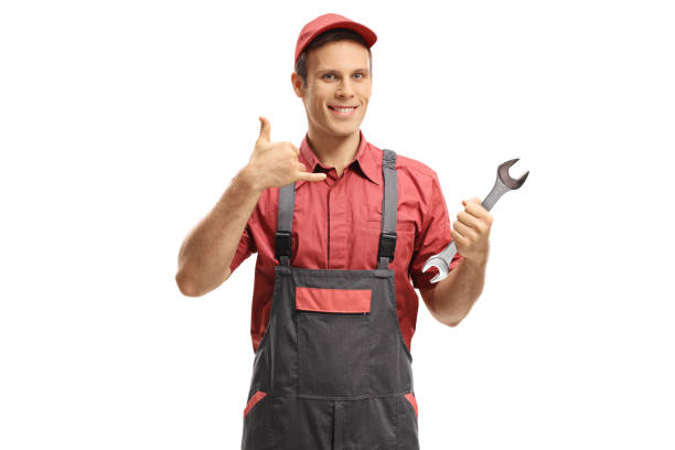 istock Repairman with a wrench making a call me gesture 887410670