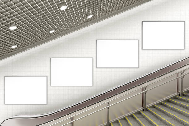 istock Blank advertising poster on underground escalator wall 887419344