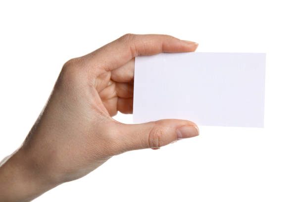 istock Female hand holding a blank business card 887435908