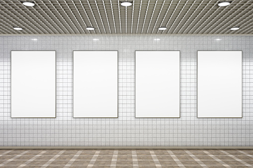 Four blank vertical advertisement posters in subway underground hall. 3d illustration