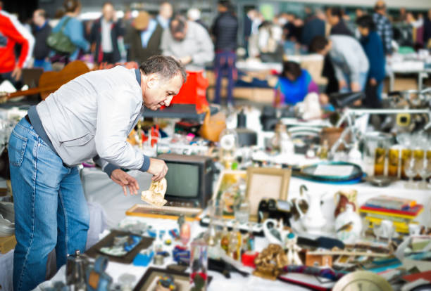 istock Man buying retro handicrafts 887436436