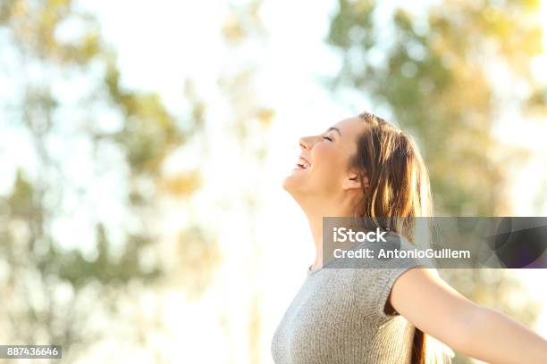 Woman Breathing Fresh Air Outdoors In Summer Stock Photo - Download Image Now - Women, Inhaling, Nature