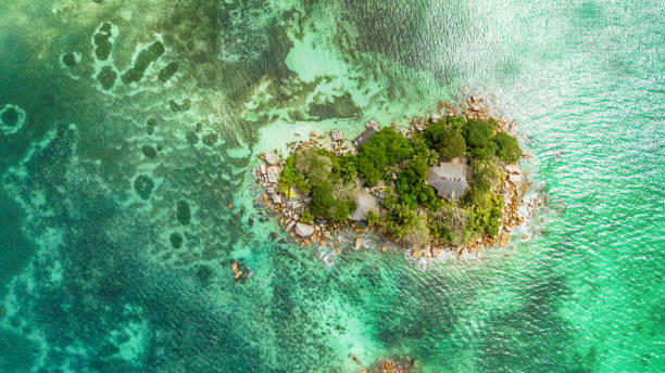 Flying over a little island - Seychelles Flying over a little island - Seychelles mahe island stock pictures, royalty-free photos & images