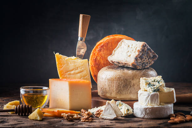 various types of cheese various types of cheese on rustic wooden table goat photos stock pictures, royalty-free photos & images