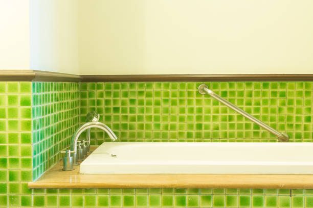istock white bathtub in green cozy bathroom 887442212