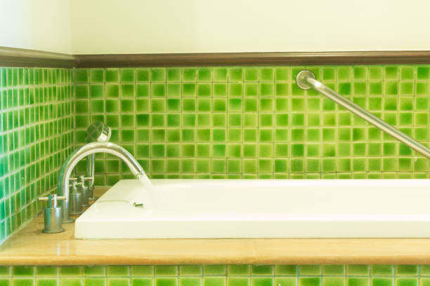 istock white bathtub in green cozy bathroom 887442236