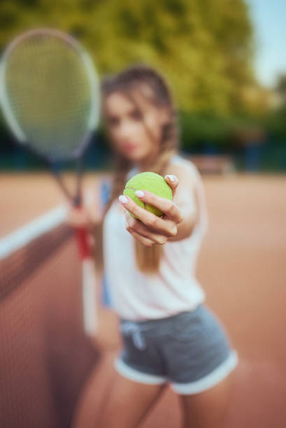 istock Girl playing tennis 887442428
