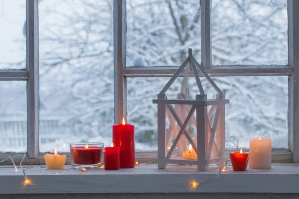 istock wooden lantern on windowsill on background winter landscape 887446828