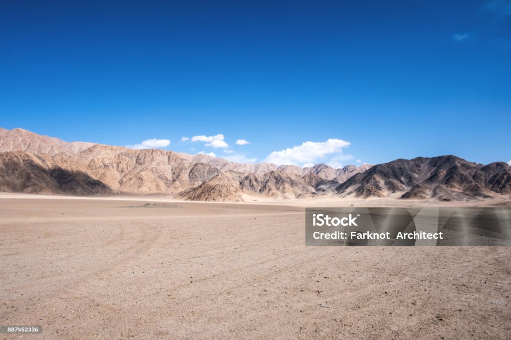 Landscape image of mountains and blue sky background in Ladakh , India Desert Area Stock Photo
