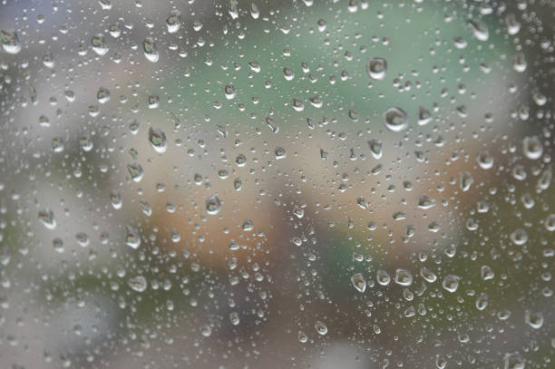 istock Drops of rain on the window, rainy day 887452482