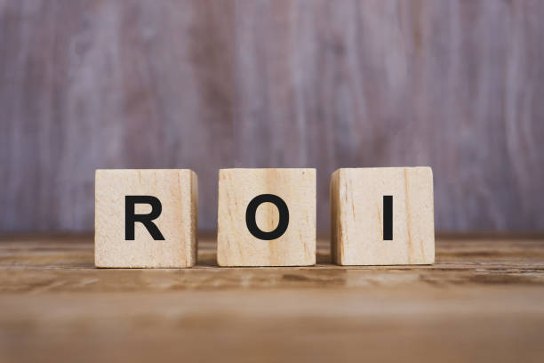 istock ROI - Return on Investment on Wooden Blocks 887453140