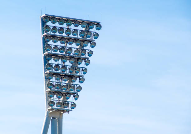 istock Low Angle View Of Floodlight Against Blue Sky 887460996