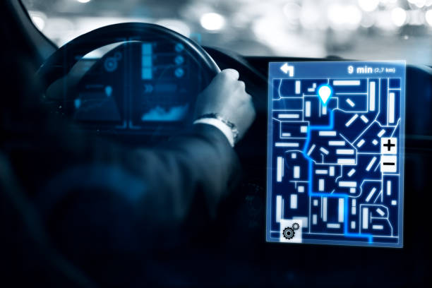 istock Man driving car with taxi interface 887463976