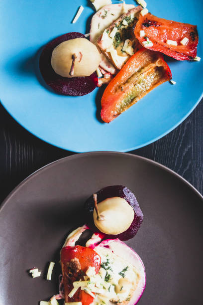 istock Two vegetarian dishes with pears on plates, view from the top 887464014