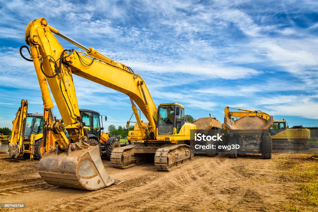 Road construction machinery on the construction of highway Road construction machinery on the construction of highway S6, Koszalin, Poland Backhoe Stock Photo