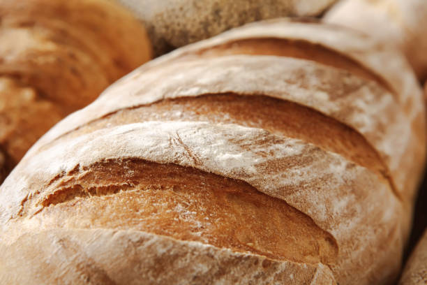 istock Bread texture background, closeup of baguette loaf 887470790