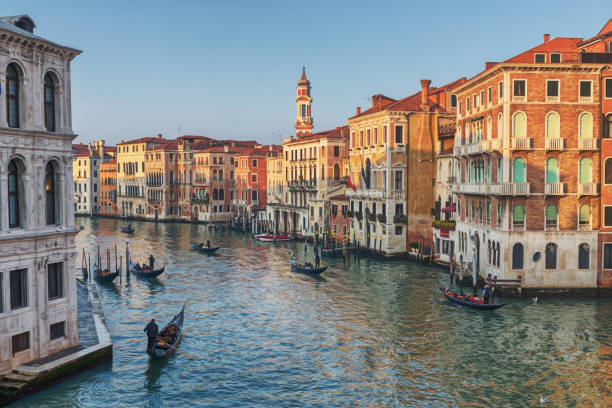 Grand Canal, Venice, Italy Venice is a city in northeastern Italy and the capital of the Veneto region. It is situated across a group of 118 small islands that are separated by canals. gondola traditional boat photos stock pictures, royalty-free photos & images