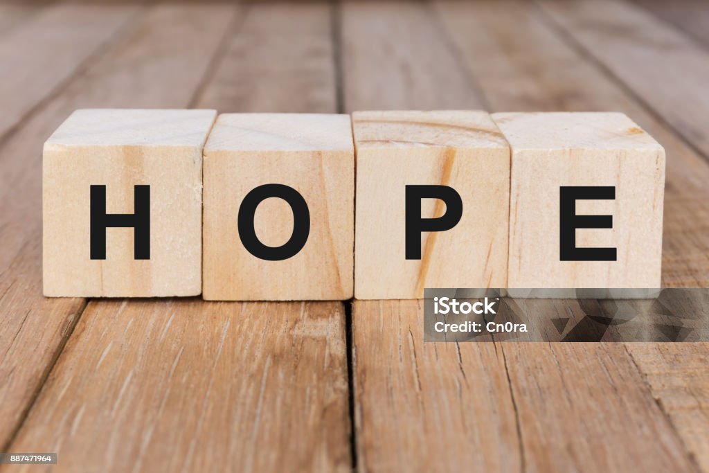 Hope Word on Wooden Block Religion and culture concept Hope - Concept Stock Photo