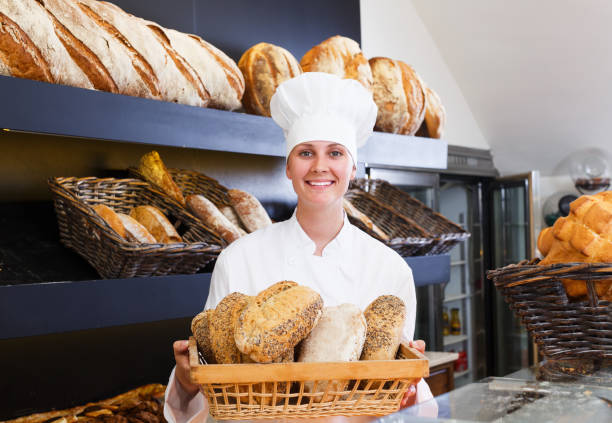 istock Woman offering bread in bakery 887476610