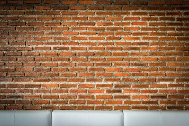 red brick wall texture grunge background with vignetted corners, may use to interior design.