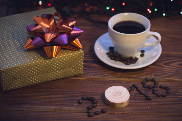 istock Still life with a coffee cup and a gift box 887478798