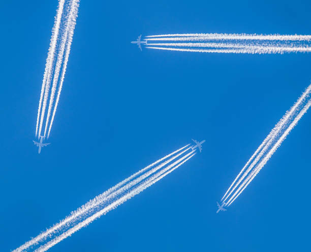 istock Contrails and airplanes crossing sky safely 887479670