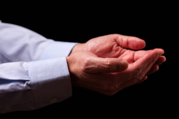 istock Mature male businessman hands together with empty palms up. 887479866