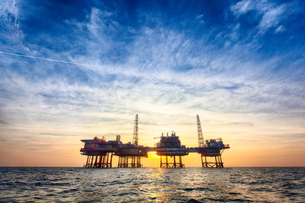 HDR offshore oil platform at sunset stock photo