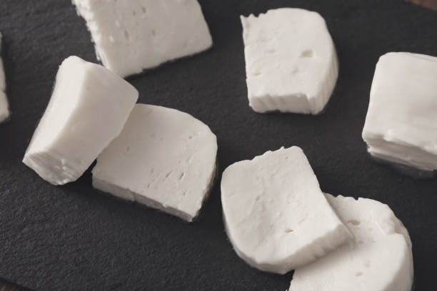 istock Homemade mozzarella on black stone background 887483222