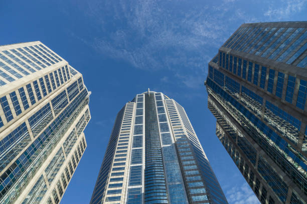 istock abstract building perspective on blue sky with clouds for background - can use to display or montage on product 887483490