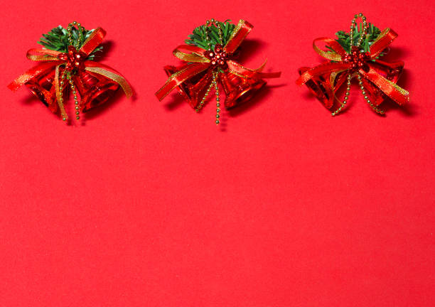 istock red bells on the red background. decoration with red bells. 887490416