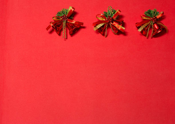 istock red bells on the red background. decoration with red bells. 887490770