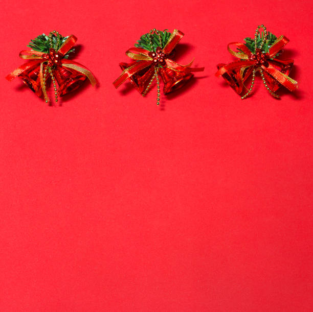 istock red bells on the red background. decoration with red bells. 887490904