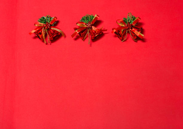 Christmas toys gold bells pattern on yellow background