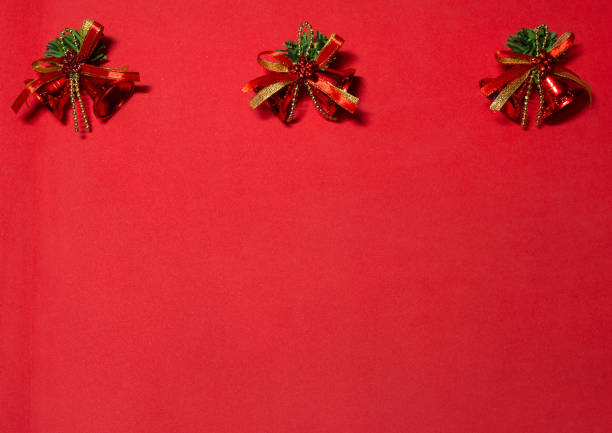 istock red bells on the red background. decoration with red bells. 887491168