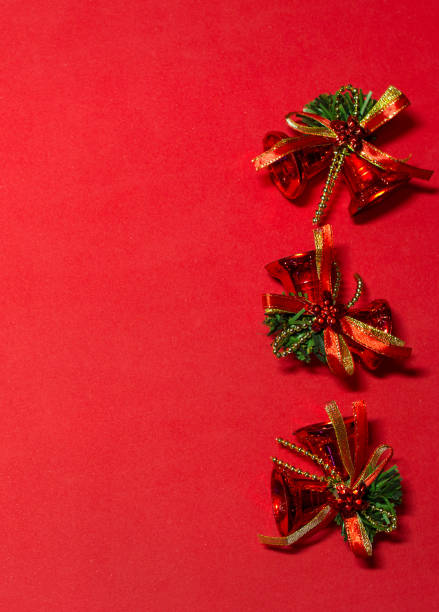 istock red bells on the red background. decoration with red bells. 887491296