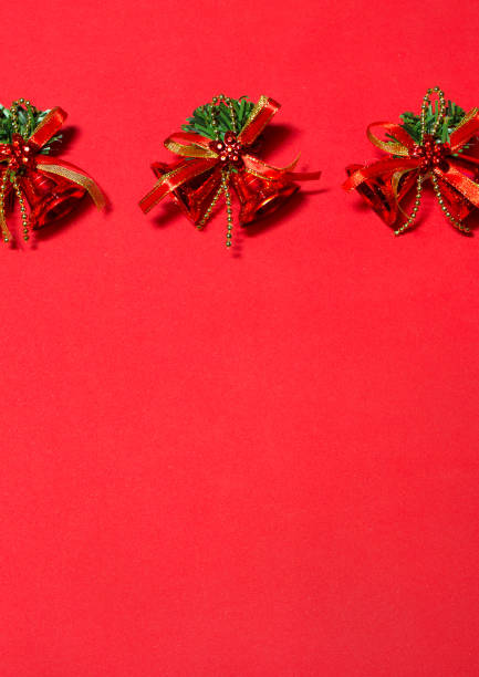 istock red bells on the red background. decoration with red bells. 887491576