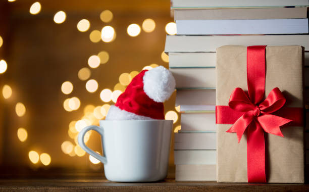 istock white cup with Christmas hat and books 887494738