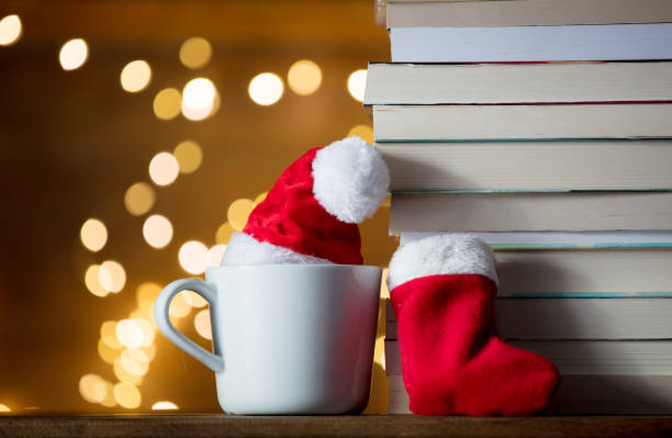istock white cup with Christmas hat and books 887494752