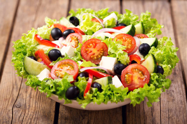 istock bowl of fresh salad on a wooden table 887500814