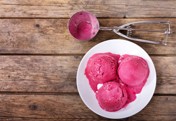 istock plate of blueberry ice cream scoops on wooden table 887500948