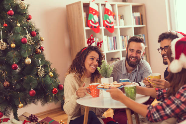 istock Friends having Christmas morning coffee 887509028