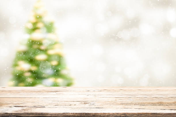 istock Wood table top on white bokeh abstract background 887520330