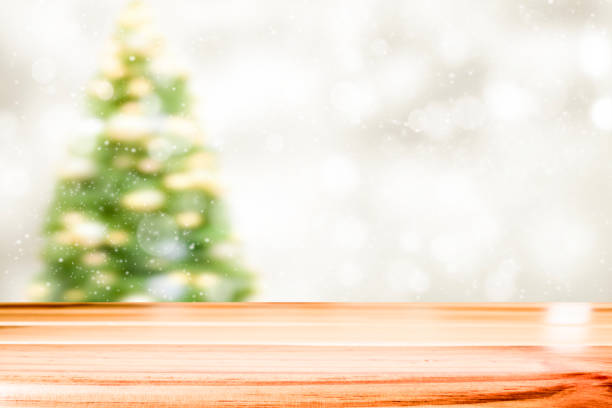 istock Wood table top on white bokeh abstract background 887520474