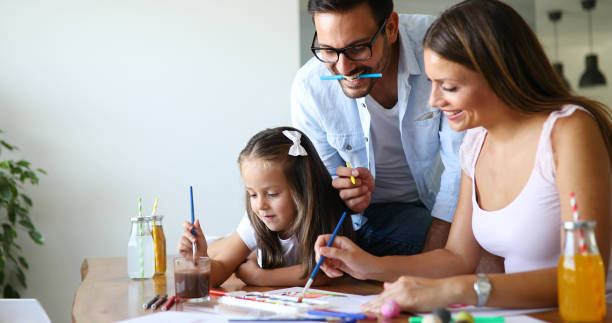 istock Happy familiy spending fun time at home 887523080