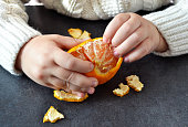 In the hands of the child's Mandarin. New Year's background.